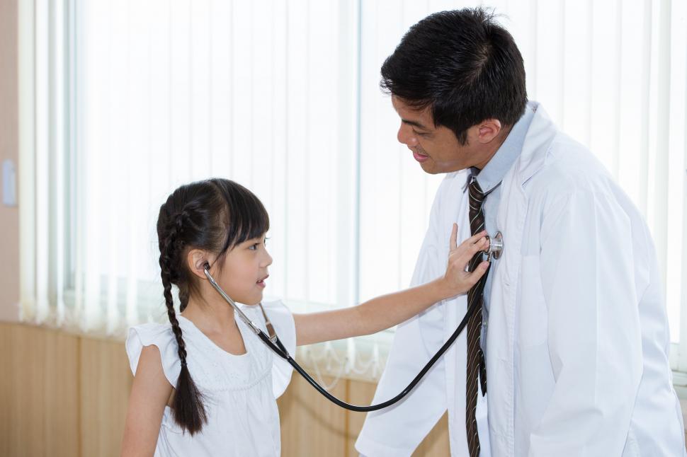 Free Image of Child listening to her doctors heart 