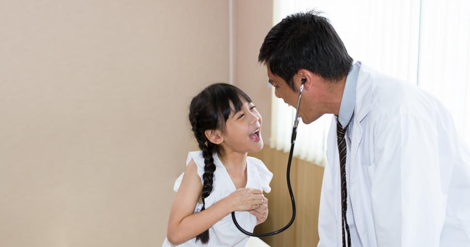 Free Image of Doctor is a having fun with child patient 