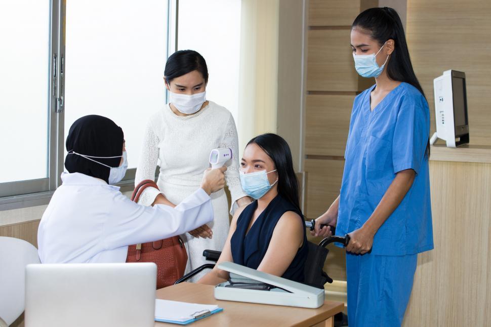 Free Image of Taking body temperature to measure fever. 