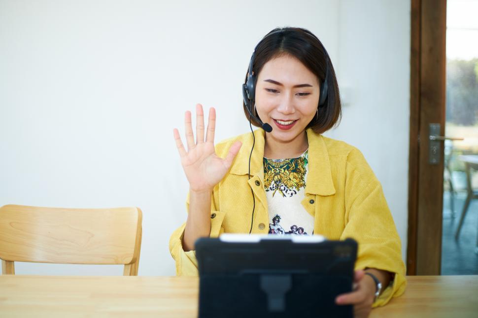 Free Image of Woman attending a teleconference on a tablet. 