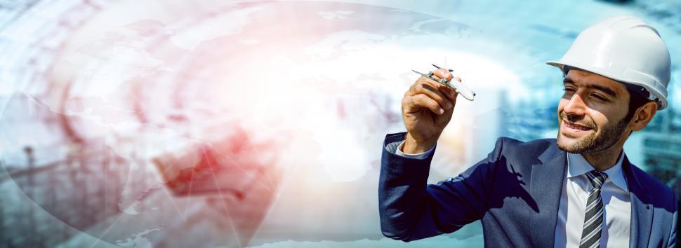 Free Image of Aircraft engineer concept, Caucasian male holding toy plane 
