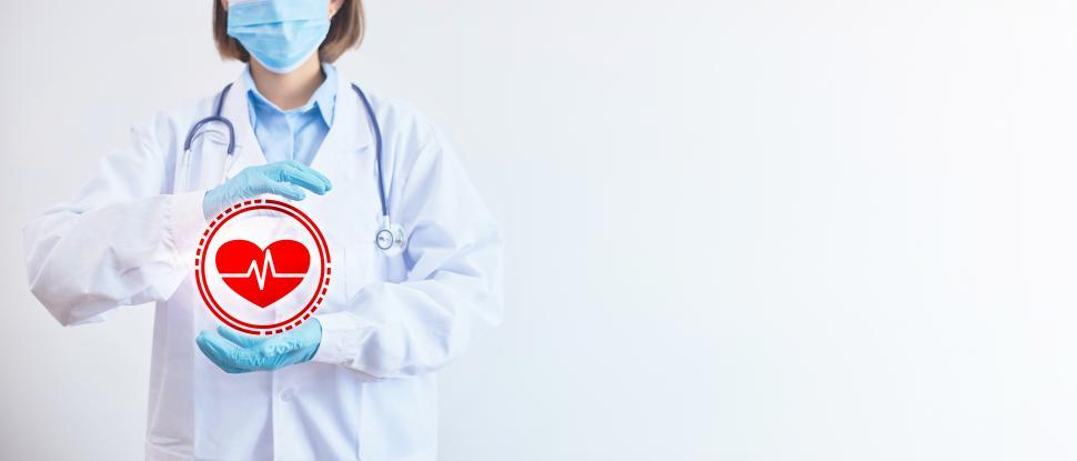 Free Image of Doctors holding space for heart health with copyspace 