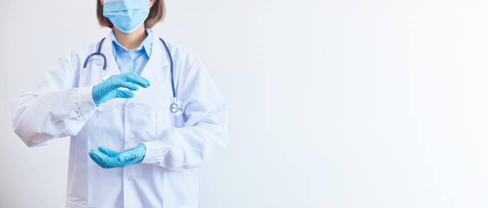 Free Image of Doctor or scientist shows a protective gesture with empty hands. 