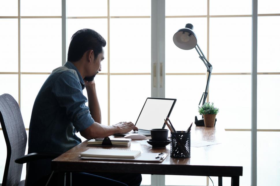 Free Image of Man working in a bright room 