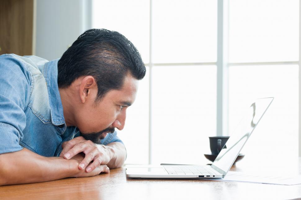 Free Image of Business Owner staring at the laptop screen 