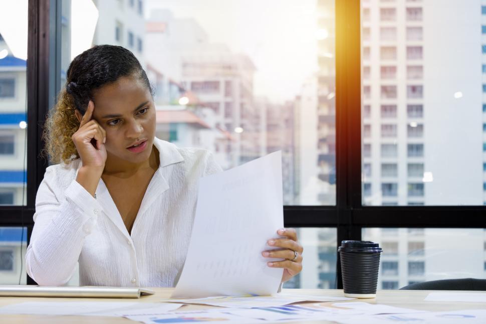 Free Image of Young woman sitting at computer desk 