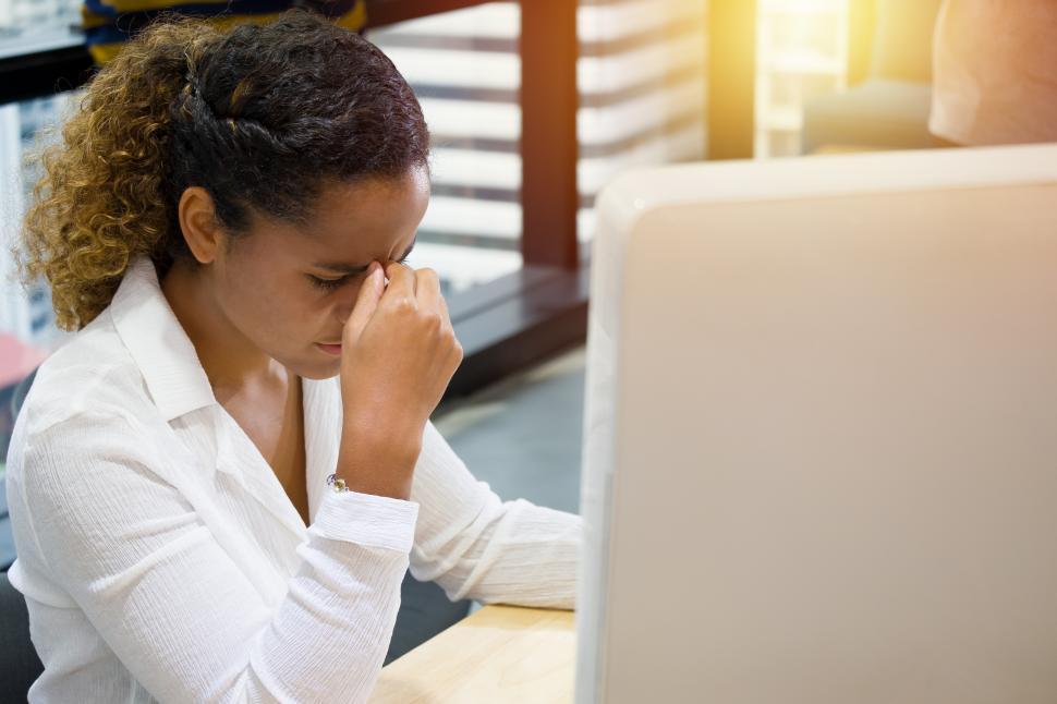 Free Image of Tense woman working 