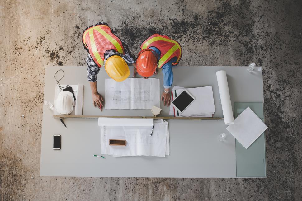 Free Image of Top view of architects and engineers creating a blueprint 