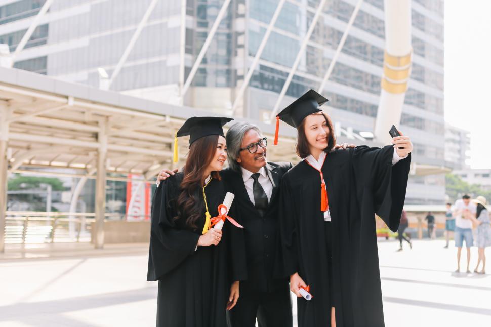 Free Image of Graduates with family member 