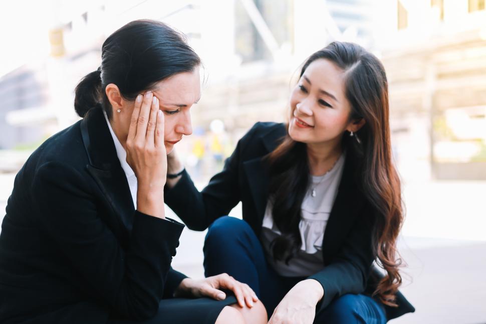 Free Image of Business woman comforting a colleague  