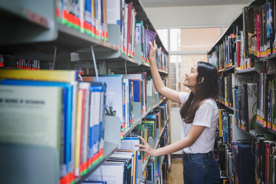 Free Image of Woman in the library stacks 