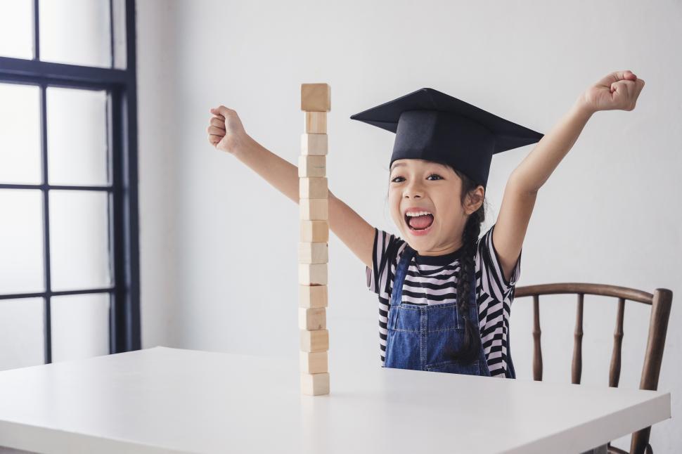 Free Image of Little girl celebrates accomplishment 