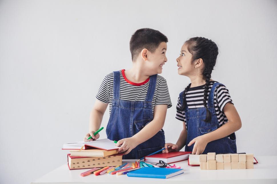 Free Image of Brother and sister teasing each other, being silly 