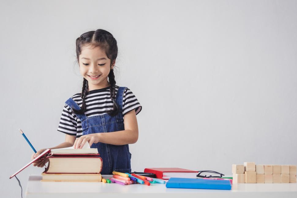 Free Image of Happy kid with open book 