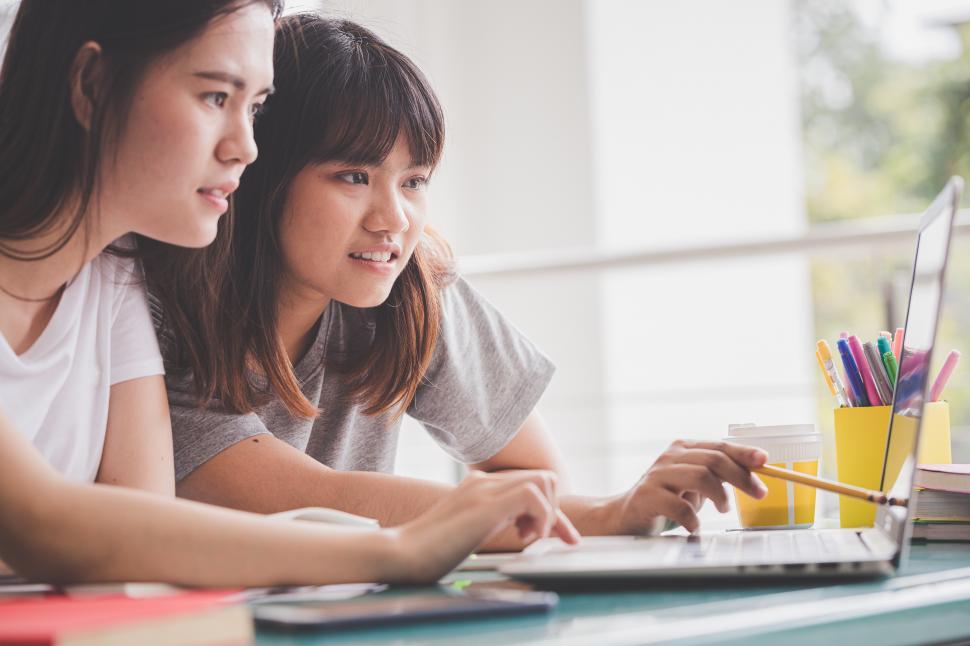 Free Image of Two Students Learn from Computer 