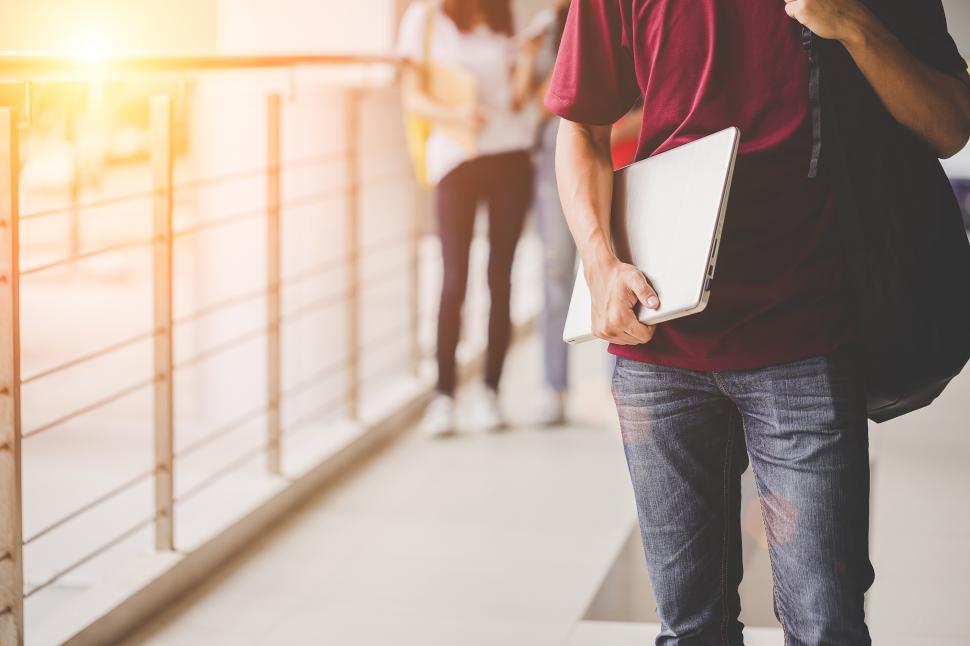 Free Image of Anonymous teens in the university and modern technology 