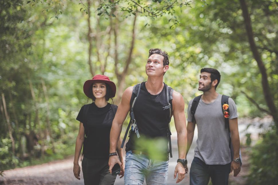 Free Image of Camping concept - Men and women having fun in the forest 
