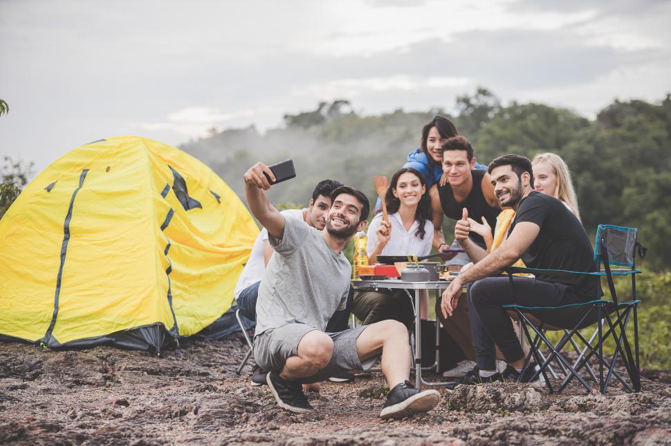 Free Image of Camping season, Group of campers are having fun taking selfies 