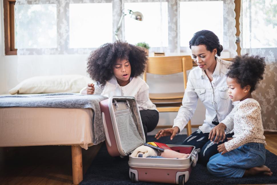 Free Image of Travel concept of mother and children packing for trip 