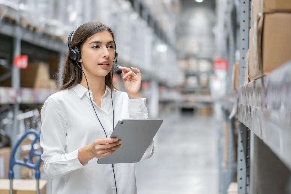 Free Image of Warehouse woman using digital tablet checking stock 