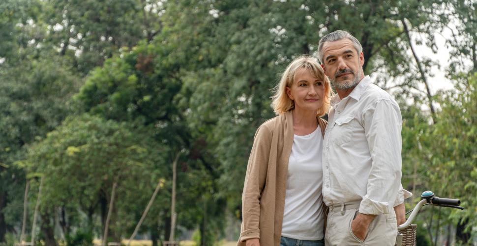 Free Image of Senior couple standing together in the park 