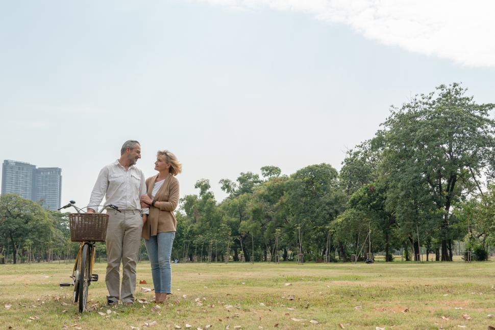 Free Image of Couple embrace together with bicycle in the park 