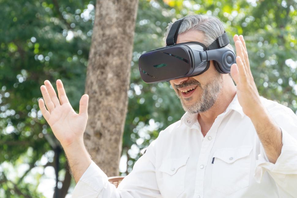 Free Image of Portrait of man shocked or excited while watching VR content 