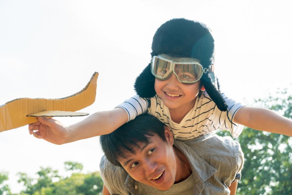 Free Image of Boy wearing pilot helmet playing airplane games 