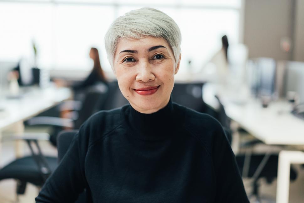 Free Image of Portrait of senior female manager at desk in the office 
