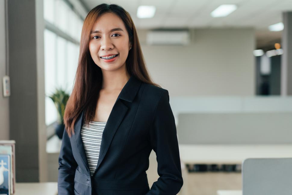 Free Image of Portrait of female employee smiling at the camera 