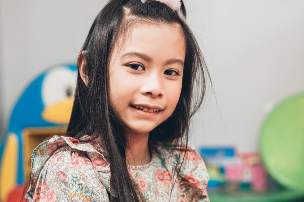 Free Image of Child smiling and looking at camera. 