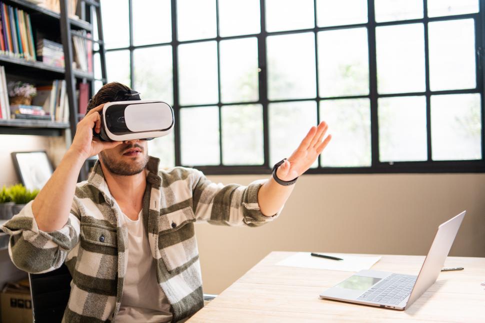 Free Image of Young product designer wearing VR glasses 