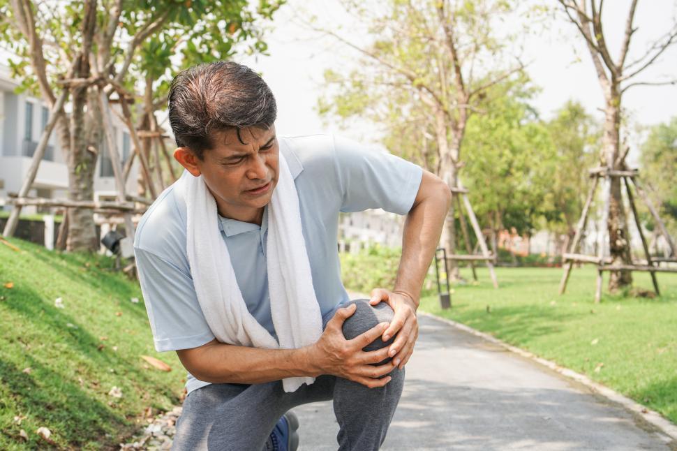 Free Image of Senior man falling down and getting knee hurt 