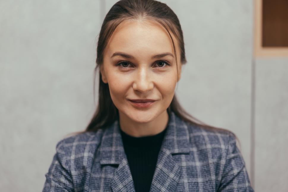 Free Image of Portrait of young secretary sitting at desk in the office 