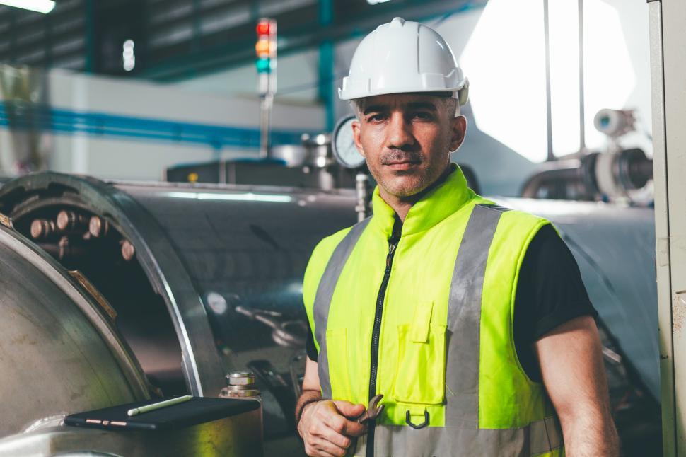 Free Image of Portrait of engineer foreman holding wrench in industrial factor 