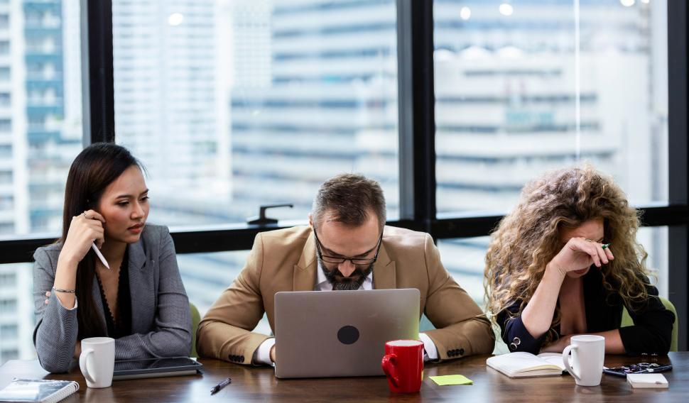 Free Image of Group of businesspeople distraught from financial news 