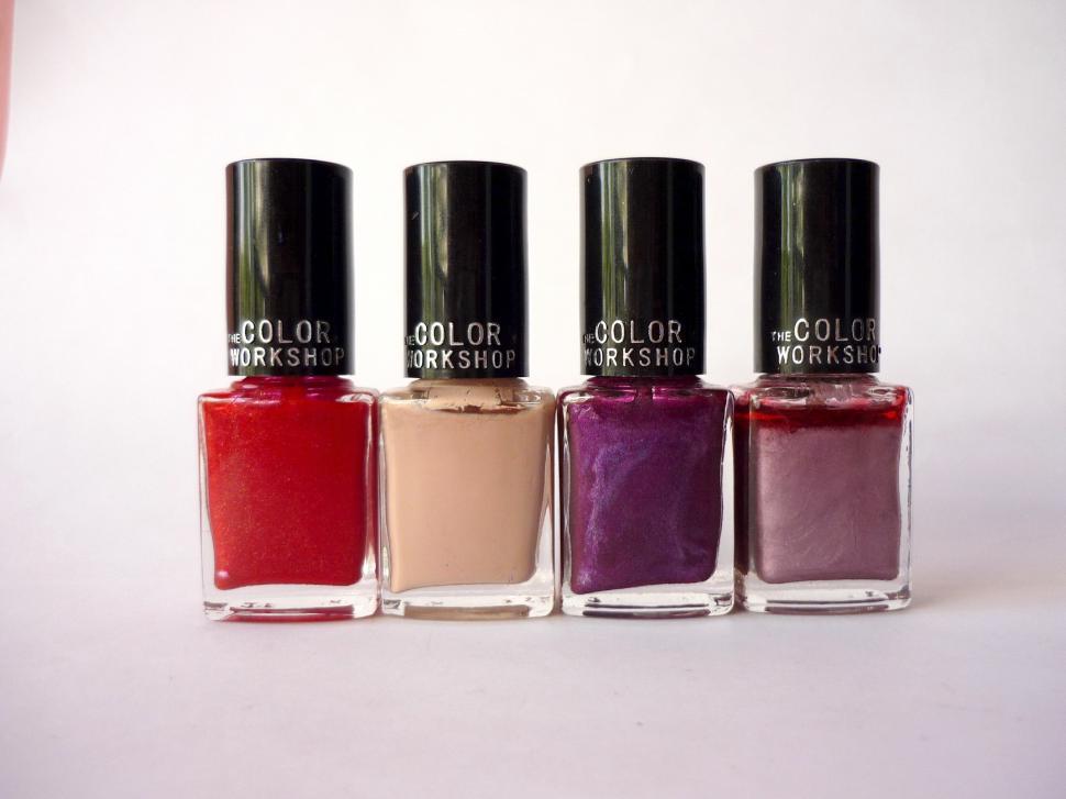 Free Image of Three Bottles of Nail Polish Together 