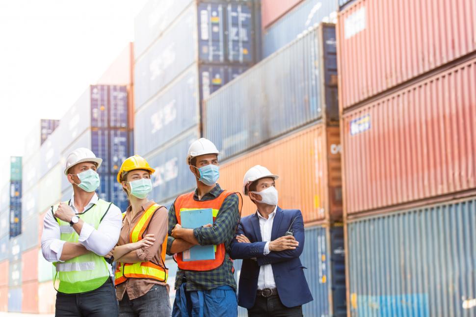 Free Image of Group of logistics workers with arms crossed 