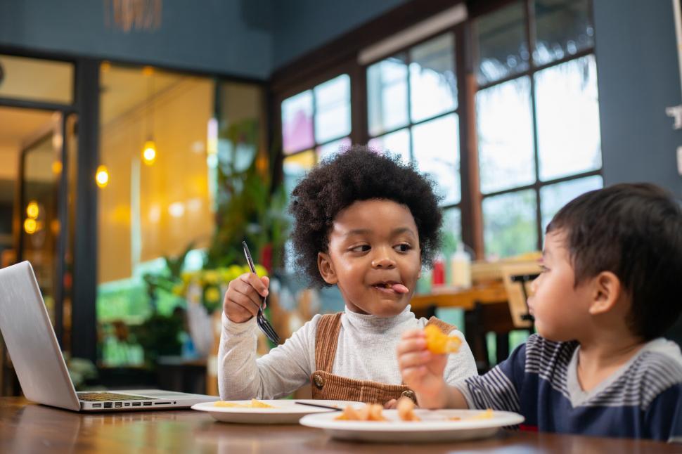 Free Image of Boys enjoy eating snack together 
