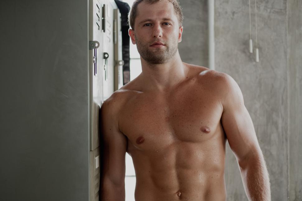 Free Image of Portrait of muscular shirtless man looking at camera 