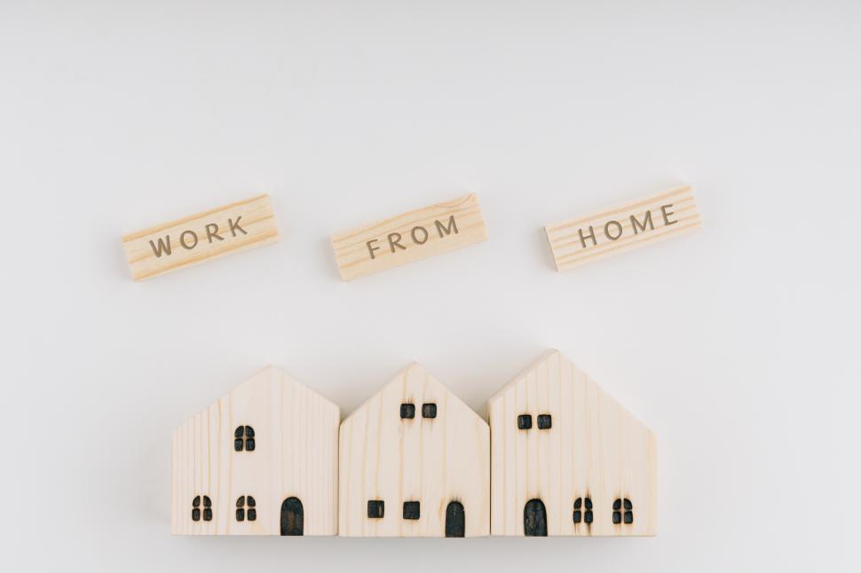 Free Image of WORK FROM HOME wording on wooden blocks and wooden houses 