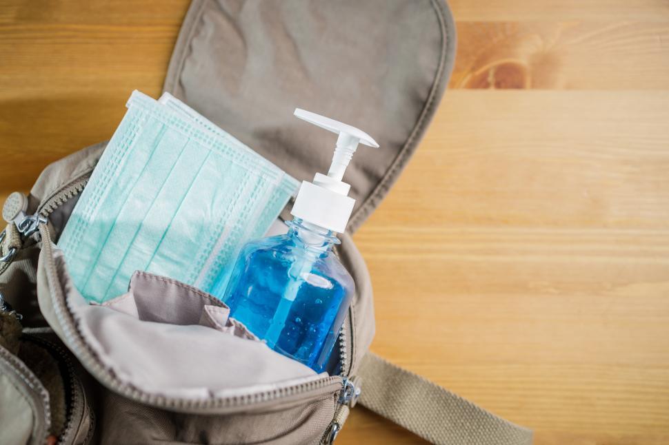 Free Image of Concept of new normal. Protective mask, alcohol gel in container 