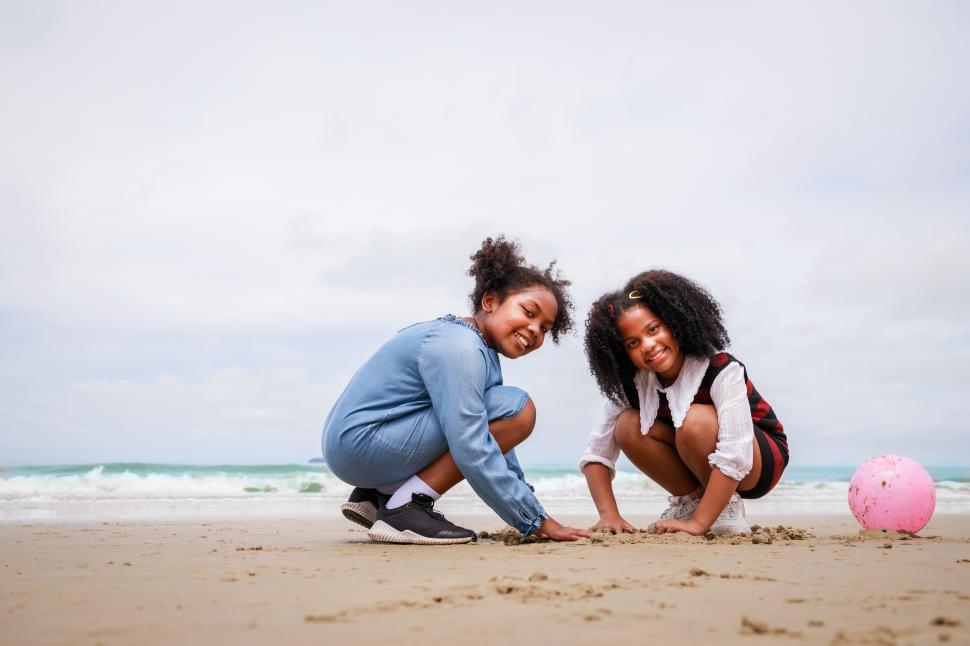 Free Image of Happy friendship. Happy vacation holiday kids on the beacgh 