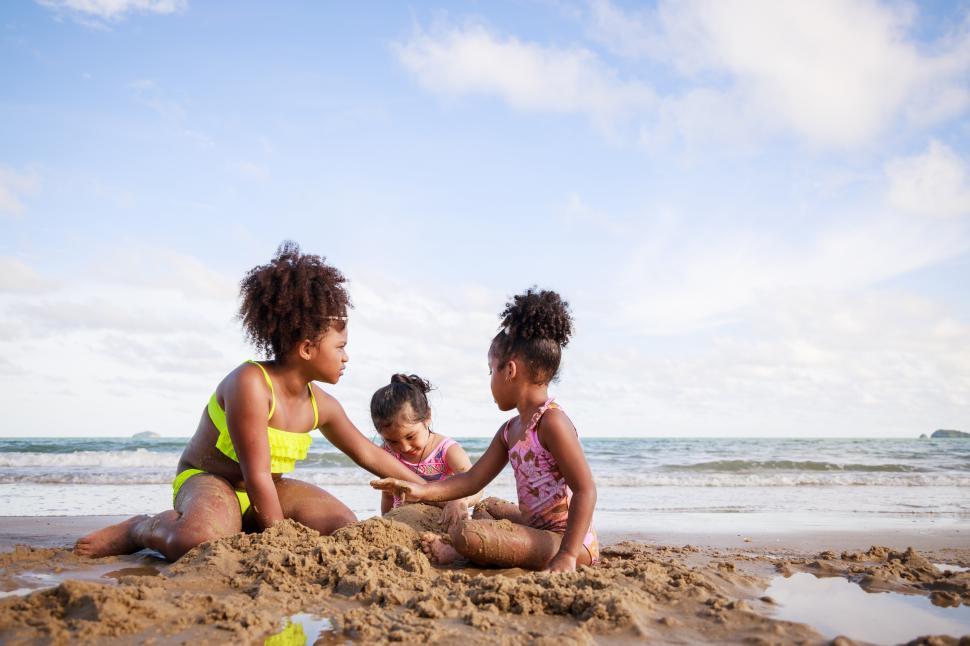 Free Image of Happy friendship. Happy vacation holiday. Happy kids on the beach. 