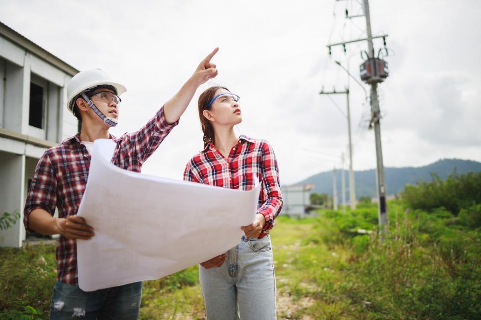 Free Image of Two Civil Engineers or field engineers planning at job site 