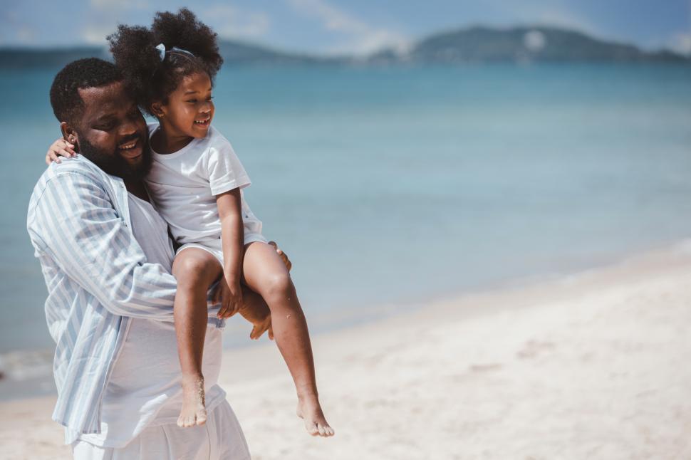 Free Image of Father carrying his daughter with cheerful love 