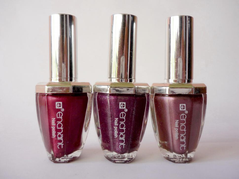 Free Image of Three Bottles of Nail Polish Arranged Neatly 