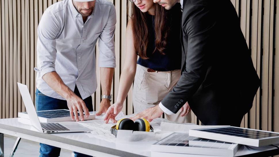 Free Image of People discussing solar technology plans 