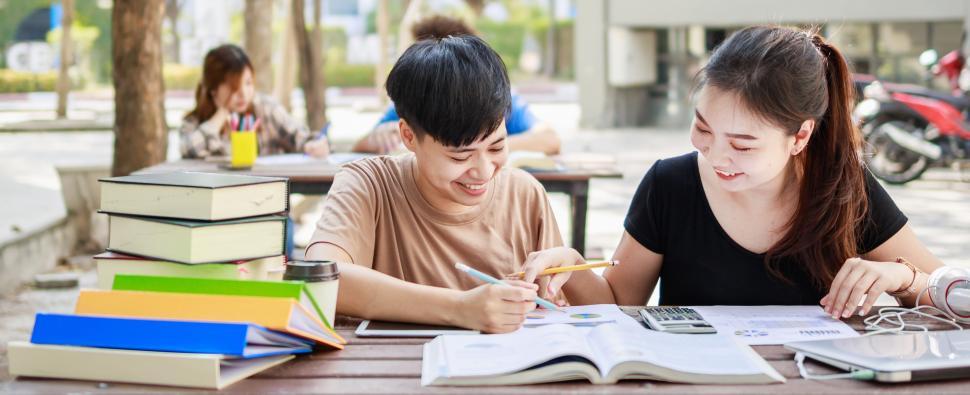 Free Image of A happy group of young people studying for exams 