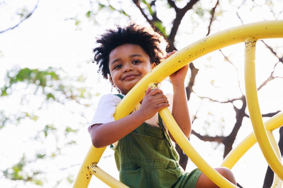 Free Image of Little kid having fun while playing on playground 